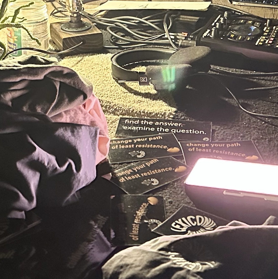 A close view of printed cards and audio equipment at the performance